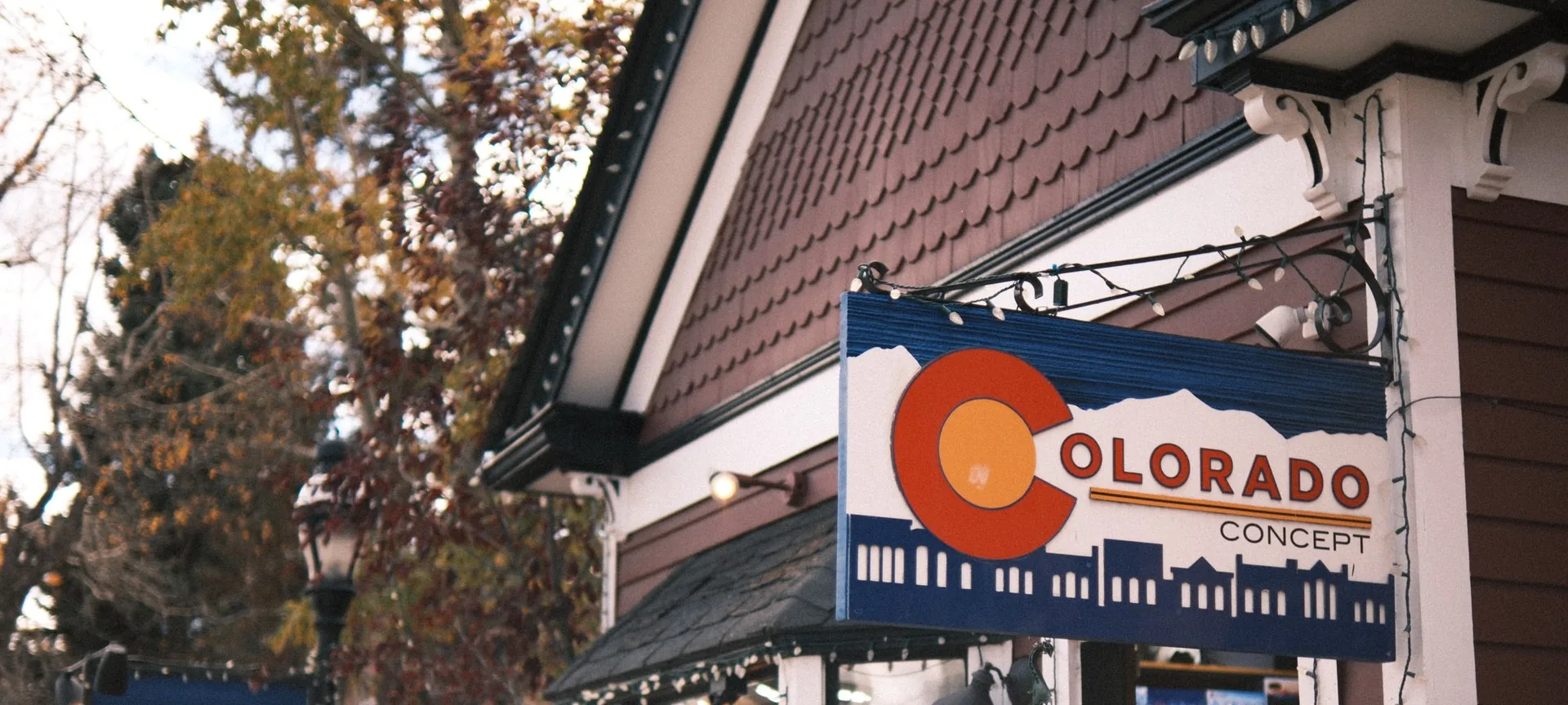 Colorado Concept sign on Main Street in Breckenridge with autumn trees