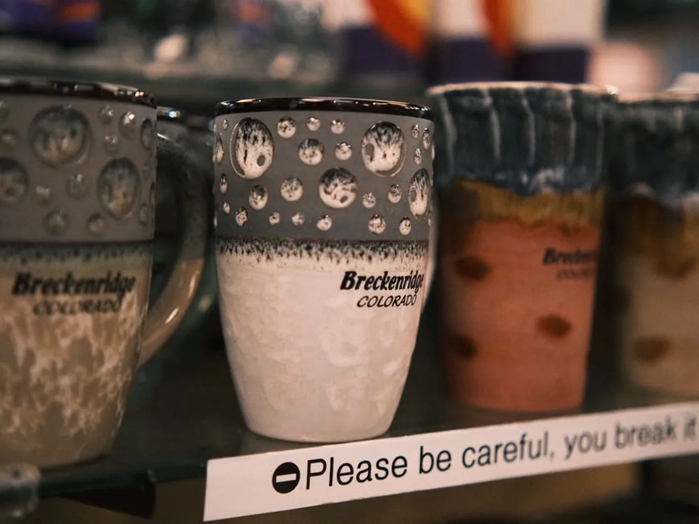 Breckenridge souvenir mugs on a store shelf