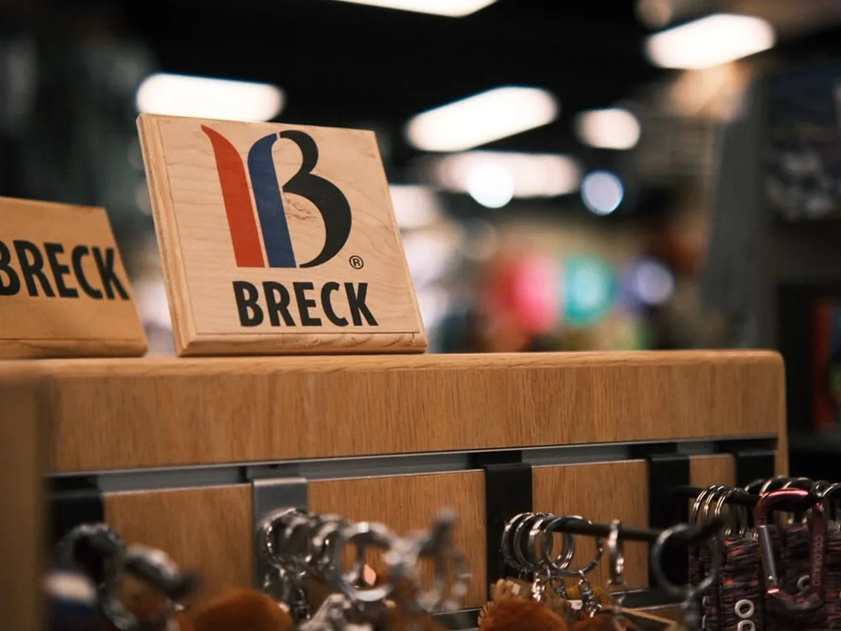 Breck wooden souvenir blocks and keychains on a store rack