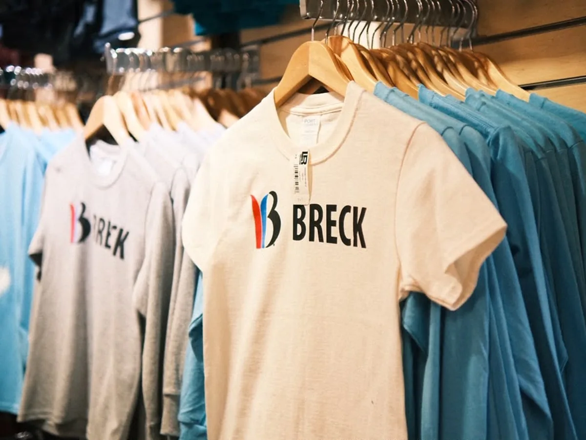 Breck-branded shirts on a clothing rack