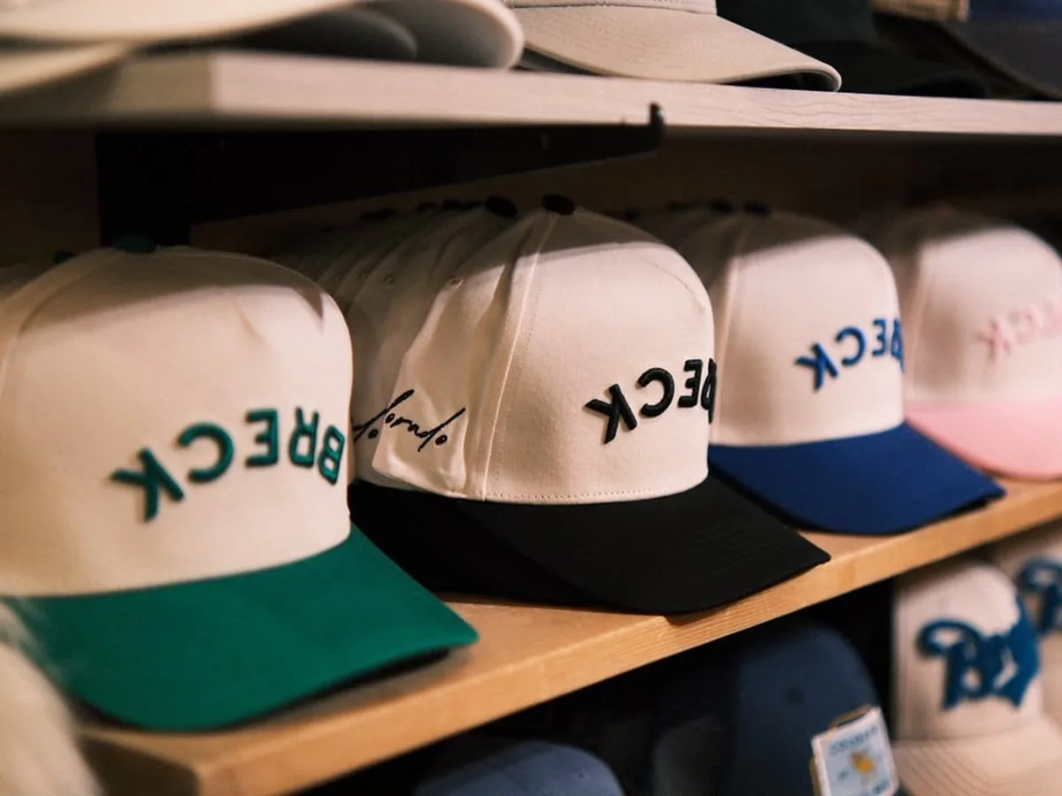 Breckenridge trucker caps on wooden shelves