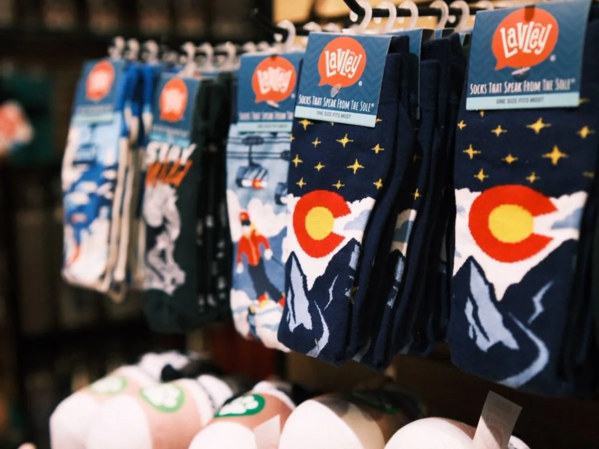 Colorado-themed socks on a display rack